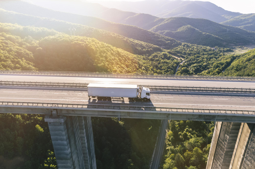 trucks-highway-mountain-sunset